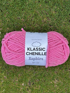 Pink skein of Klassic Chenille yarn on grass